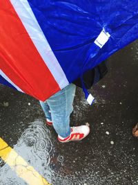 Full length of woman in umbrella