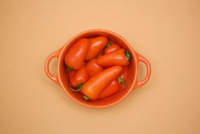 Close-up of red tomatoes over white background