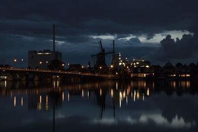 Reflection of illuminated buildings in water at night