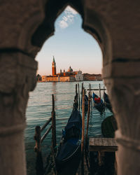 Panoramic view of sea and city against sky