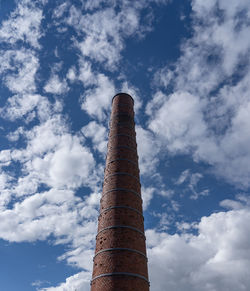 Low angle view of smoke stack against sky