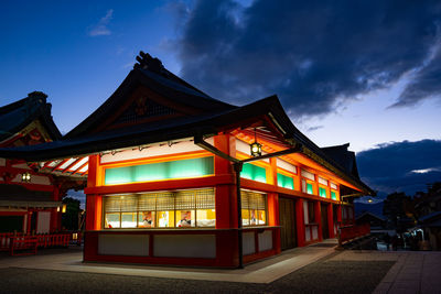 Illuminated building against sky at night