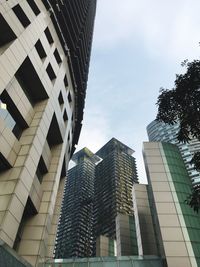 Low angle view of modern buildings against sky in city