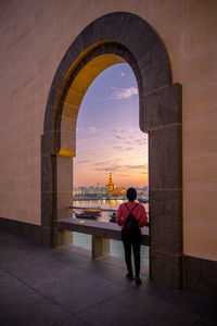 Man looking at archway