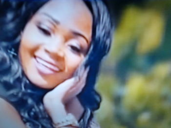 Close-up portrait of a smiling young woman