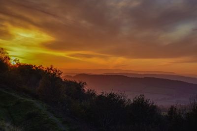 Scenic view of dramatic sky over landscape