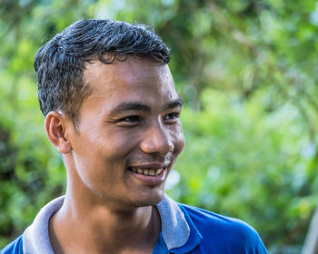 Close-up portrait of smiling mid adult man