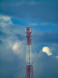 Low angle view of communications tower against sky