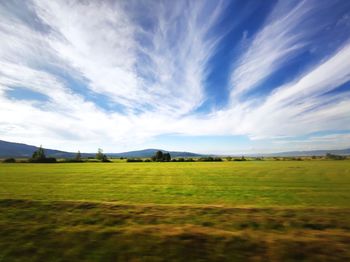 Scenic view of farm against sky