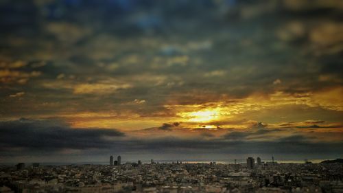 Cityscape against sky during sunset