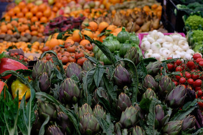 Focus on artichokes in vegetable stand