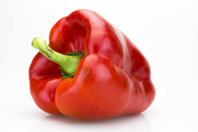 Close-up of red bell pepper against white background