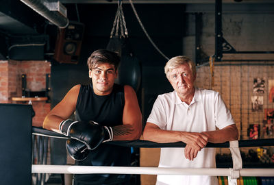 Portrait of men standing in gym