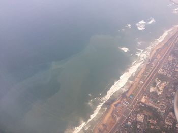 Aerial view of seascape against sky