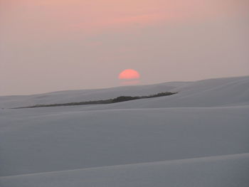 Scenic view of desert against sky during sunset