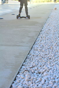 Low section of person walking on street