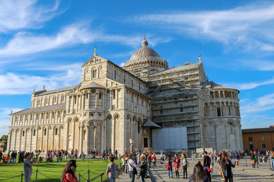 Group of people in front of historical building