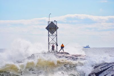 Hurricane off the coast brought in some heavy surf and brave fishermen