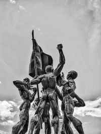 Low angle view of statue against sky