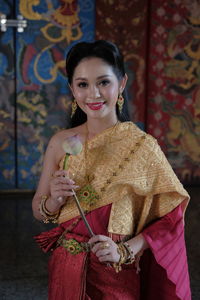 Portrait of smiling young woman wearing traditional clothing