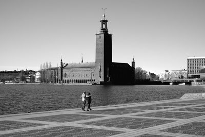 Silhouette of woman against clear sky