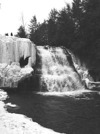 Scenic view of rock formation in water
