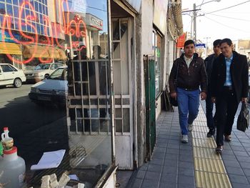 People walking on street in city