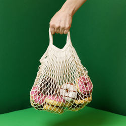 Cropped hand of woman holding teddy bear