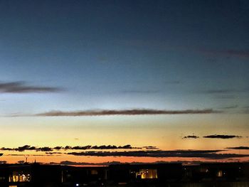 View of illuminated city at sunset