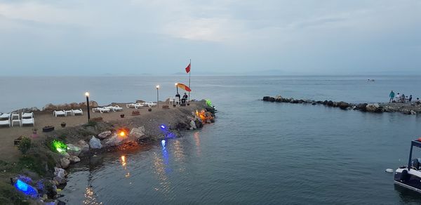 High angle view of people on beach against sky