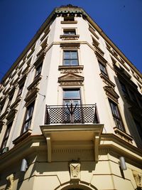 Low angle view of building against clear blue sky