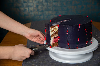 Midsection of person holding cake