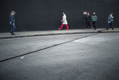 View of people walking on road