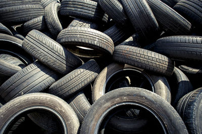 Stack of old, used car tyres.