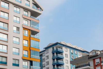 Several residential buildings against the blue sky. copy space.