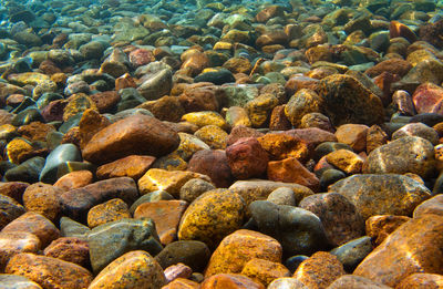 High angle view of stones in sea