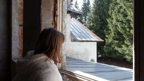 Rear view of woman with dog