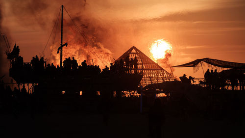 Panoramic view of silhouette bridge against sky during sunset