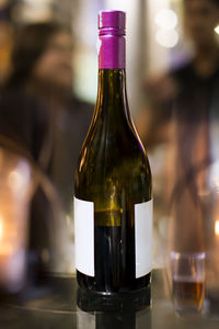 Close-up of beer bottle on table