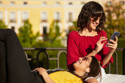 Young woman using mobile phone