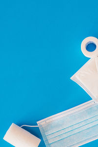 Low angle view of book against blue background