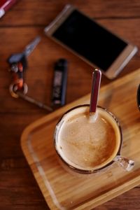 High angle view of coffee cup on table