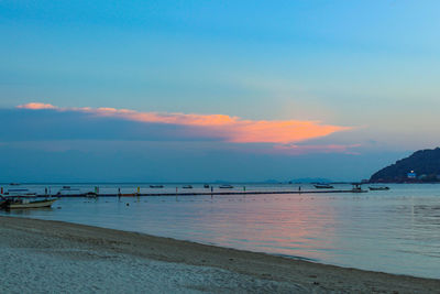 Scenic view of beach against sky during sunset