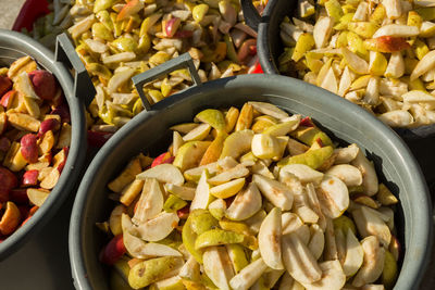 High angle view of fruits slices in container