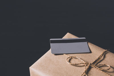 High angle view of paper box against black background