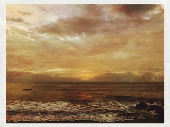 Scenic view of beach against sky during sunset