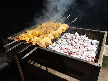 Close-up of meat on barbecue grill