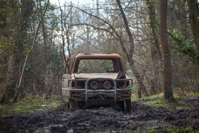 Abandoned car in forest