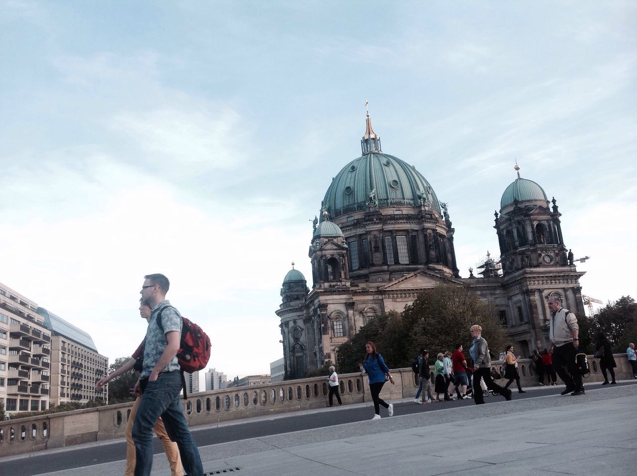 building exterior, sky, architecture, cloud - sky, travel destinations, city, built structure, dome, outdoors, men, adults only, real people, religion, day, people, large group of people, adult