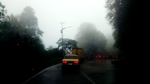 Cars on street during rainy season